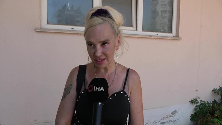 Kedisi içerdeyken evi yanan Ukraynalı kadın polisin kucağına bayıldı